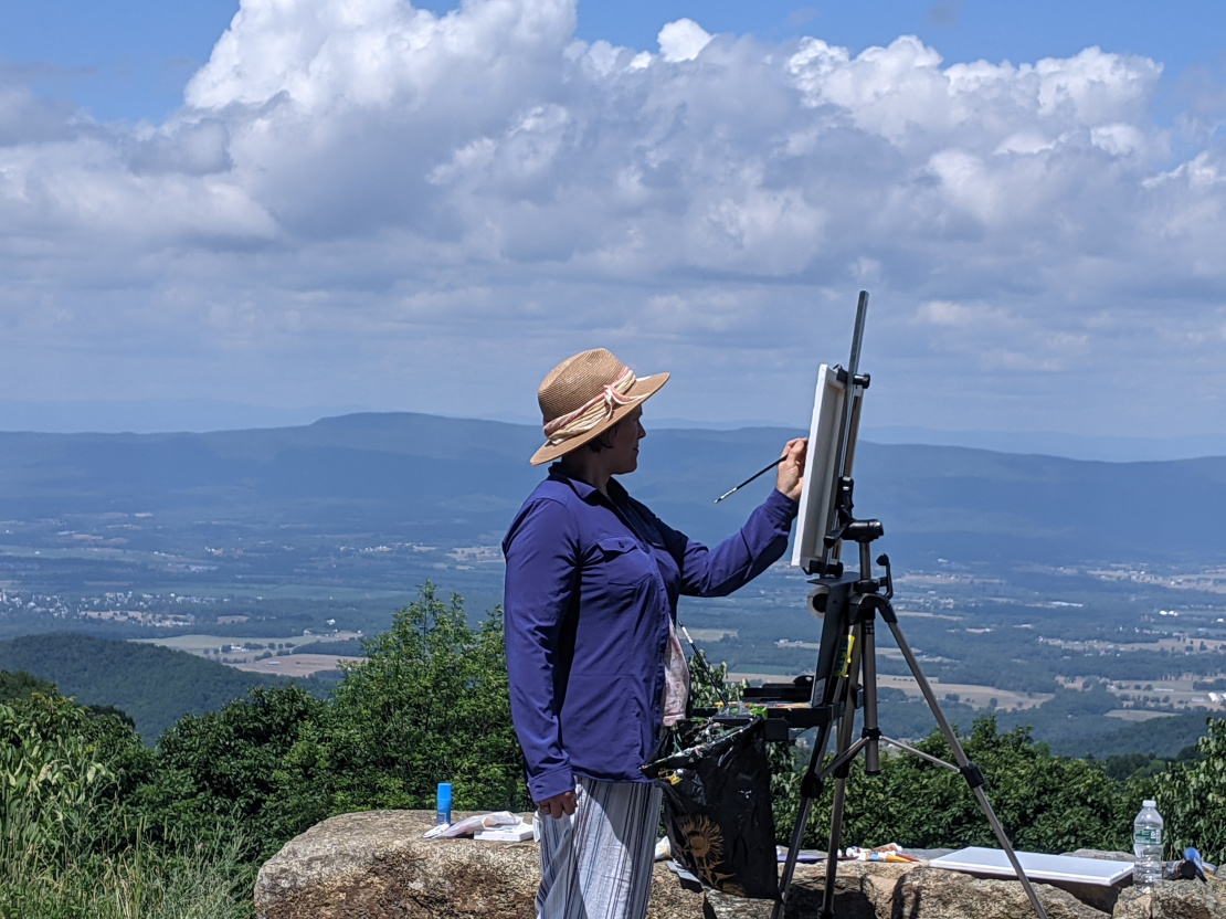 Gabi Armstrong painting the Blue Ridge Mountains. Shanandoah National Park.