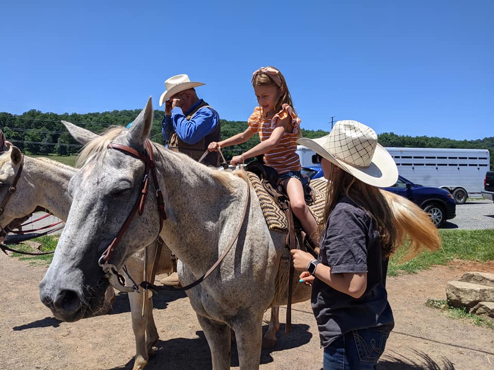 7 year old getting on a horse for the first time 