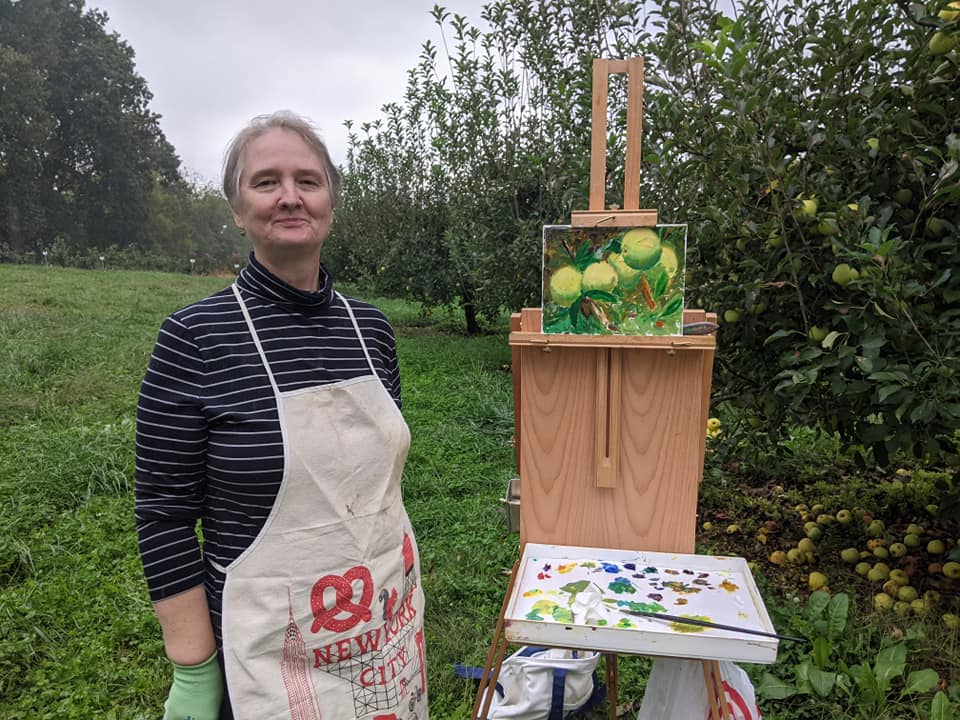 Allie Lozitsky painting apple orchards at Grelen gardens.
